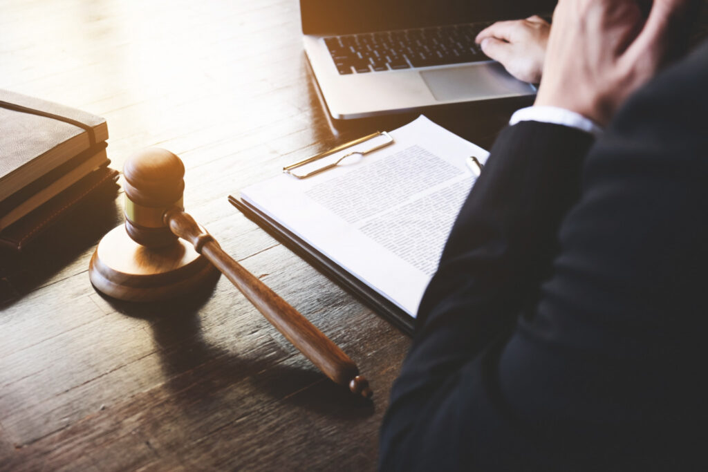 Attorney signing a legal document.