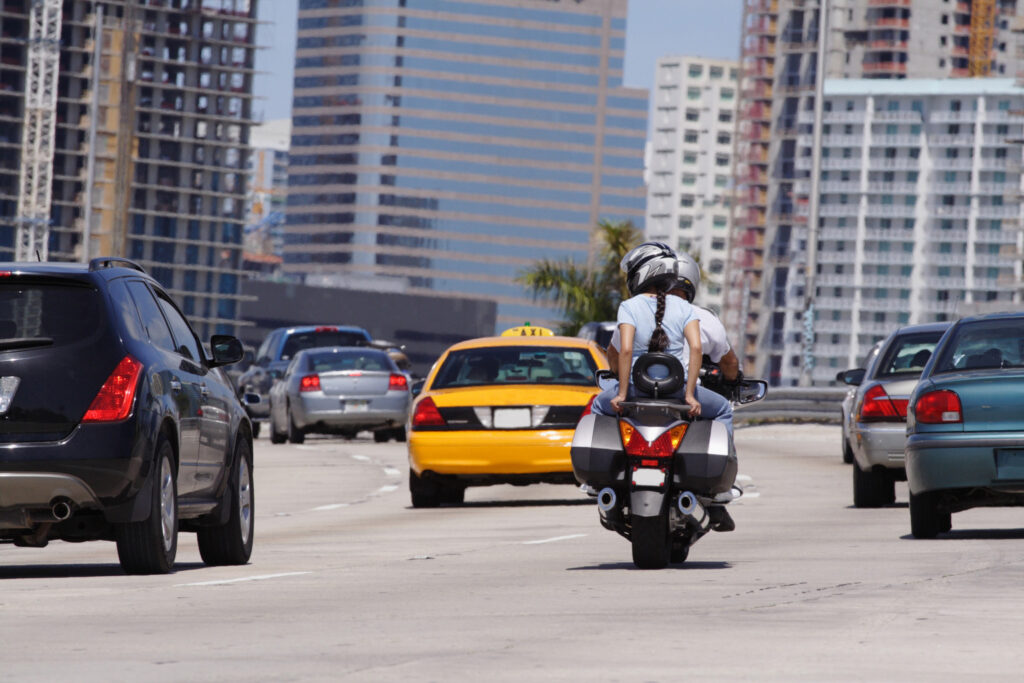 Motorcycle on busy road.