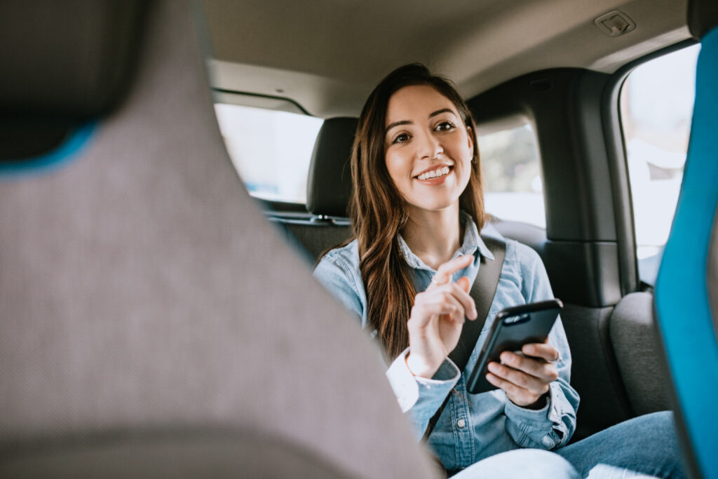 Woman in Lyft talking to driver.